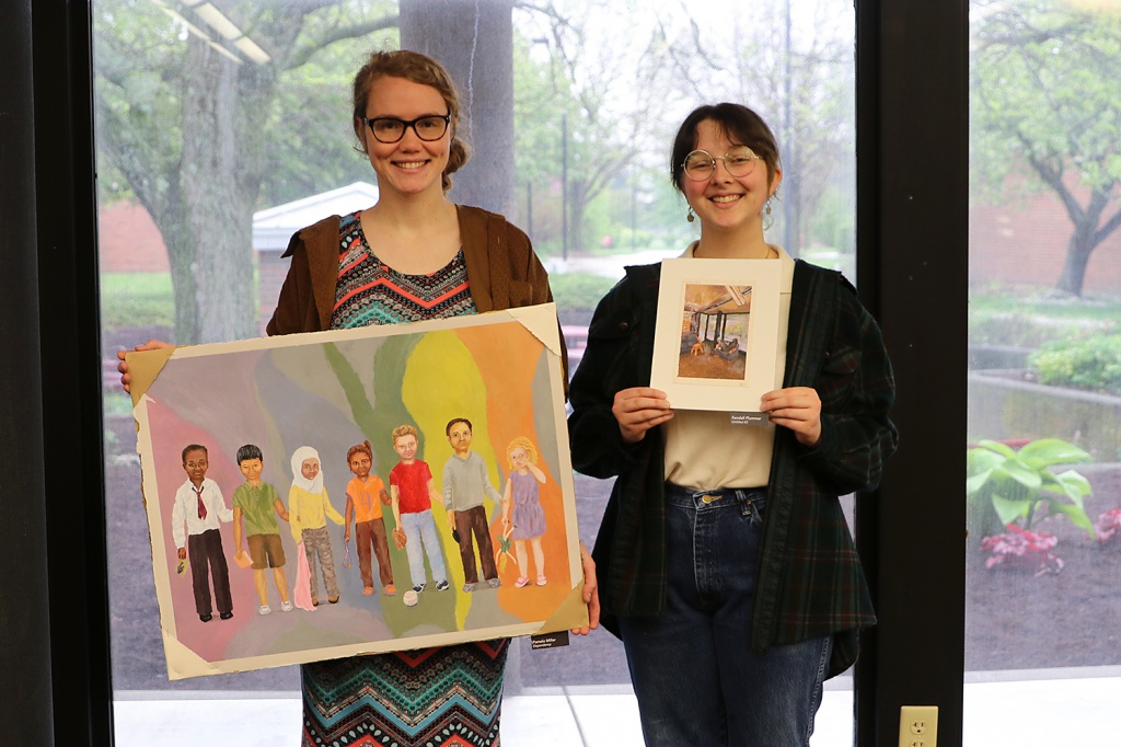 Pictured are Other Media First and Second Place winners Pamela Miller and Kendall Plummer with their pieces “Dependency” and “Untitled #3.”