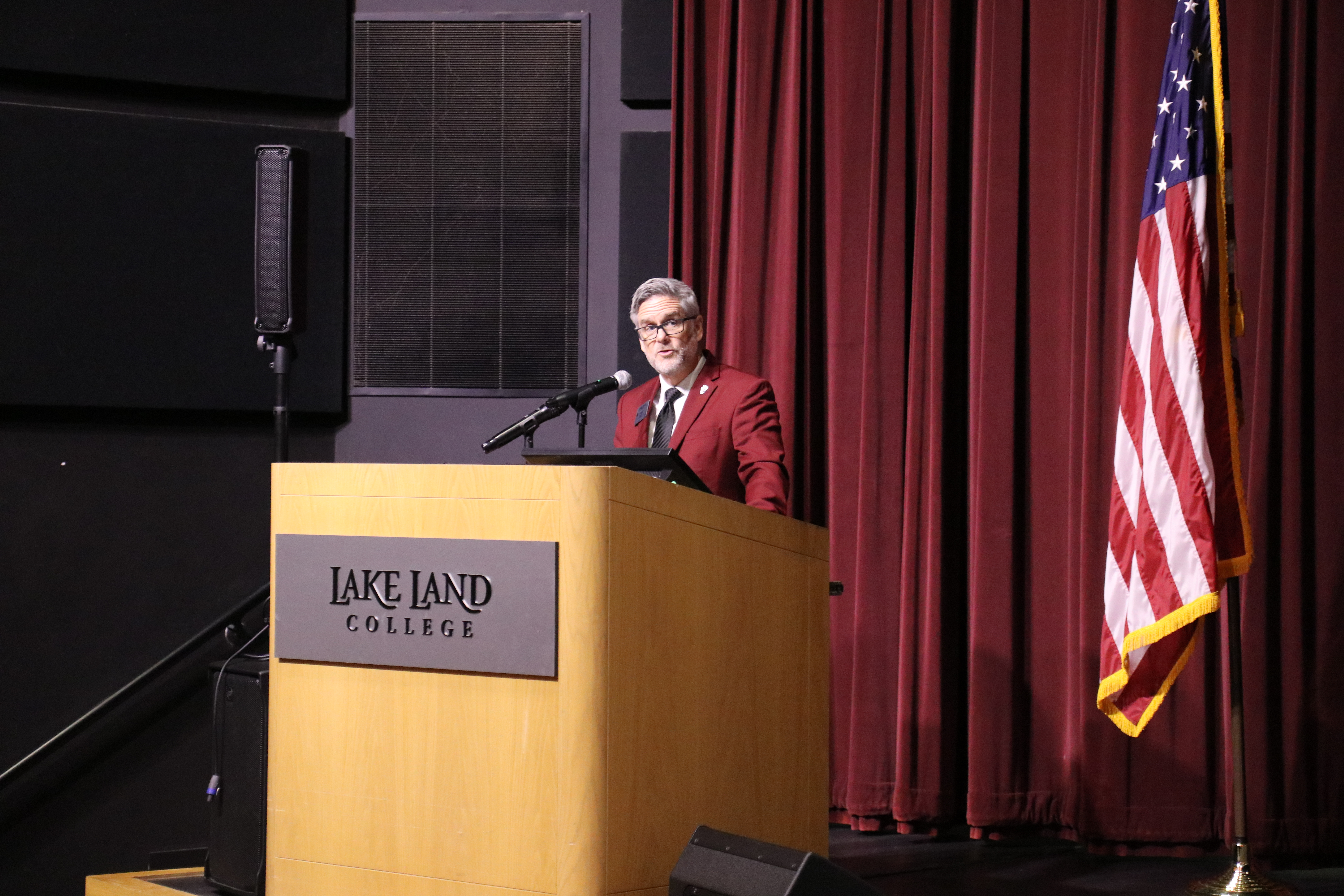 Lake Land College President presenting during a ceremony.