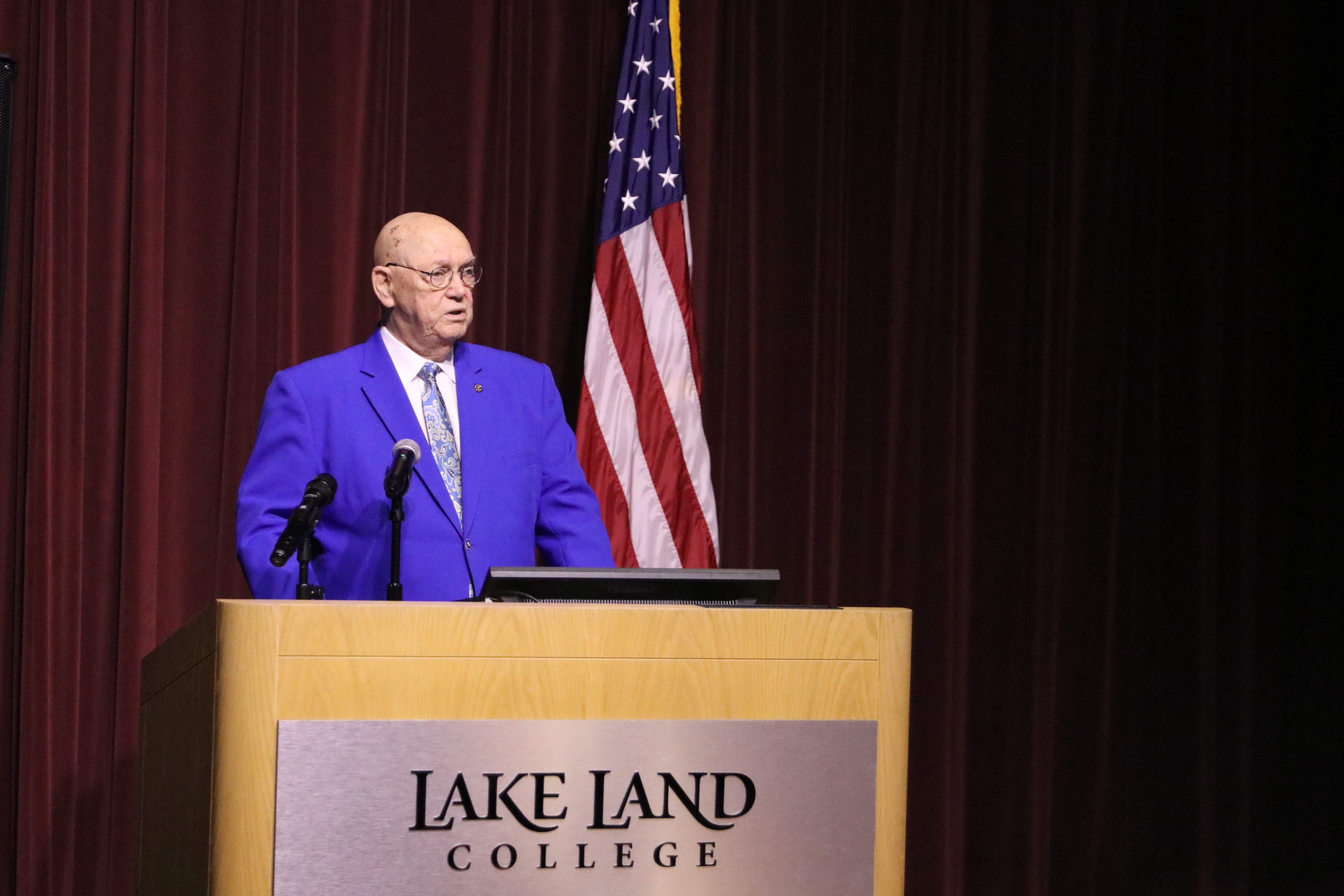 A representative of Mattoon Rotary presents during a ceremony. 