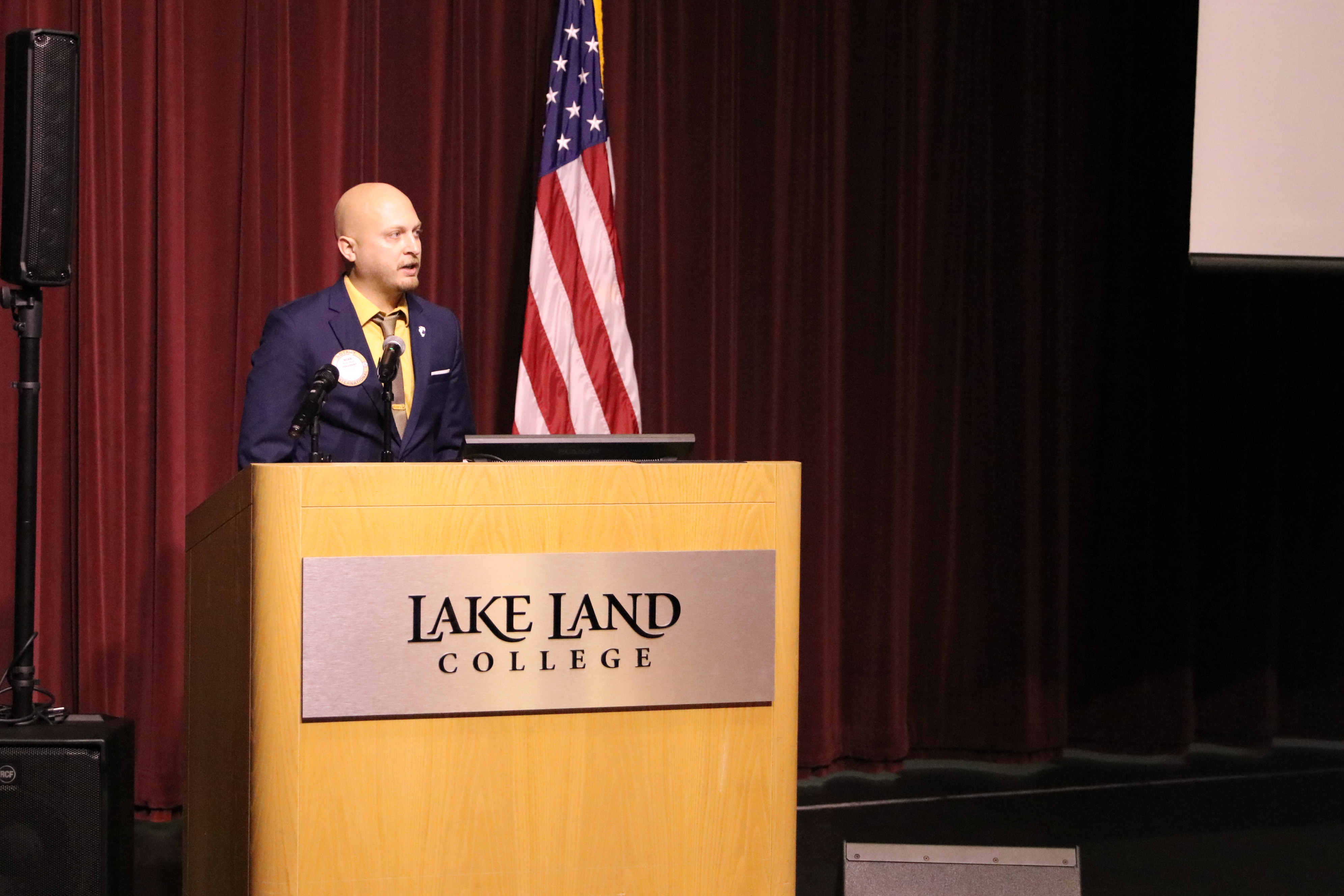 A representative of Mattoon Rotary presents during a ceremony. 