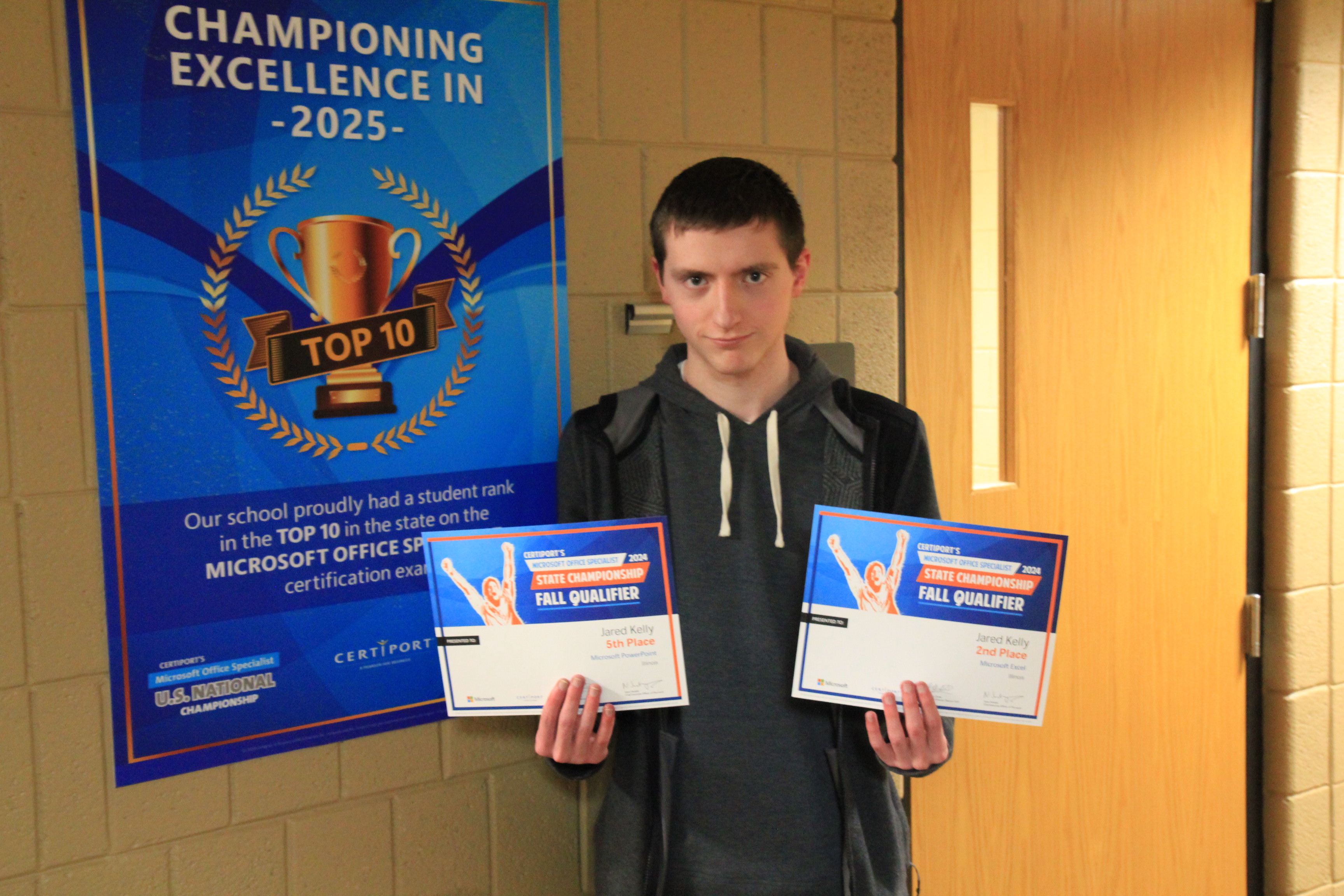 A Lake Land College student with the awards he received from the Microsoft Office Specialist State Championship.