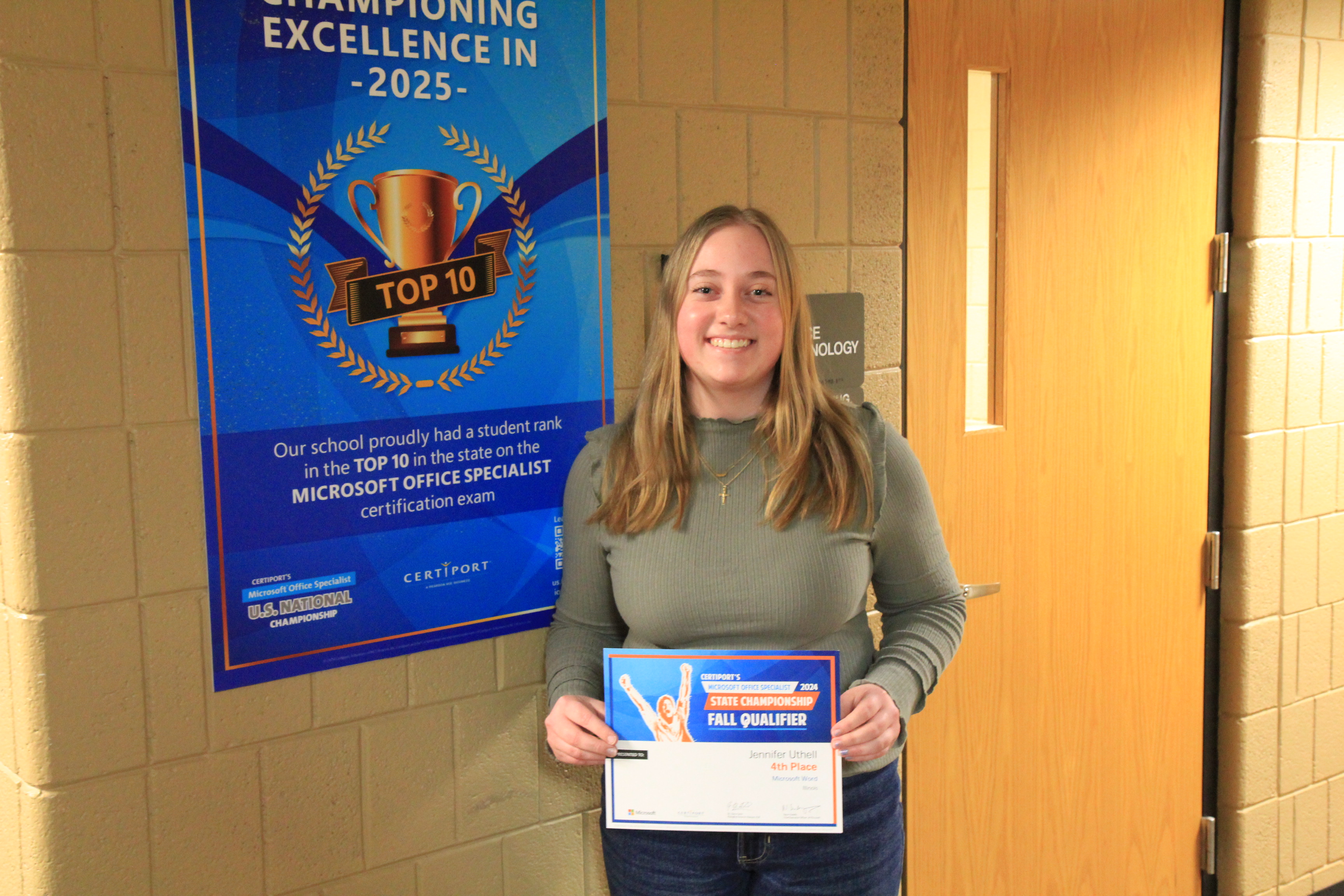 A Lake Land College student with the award she won during the Microsoft Office Specialist State Championship. 